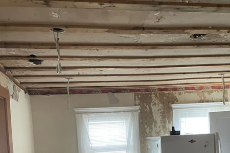 Cut out section of mold damaged drywall ready for safe disposal