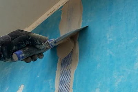 When is blue board installation better than standard drywall